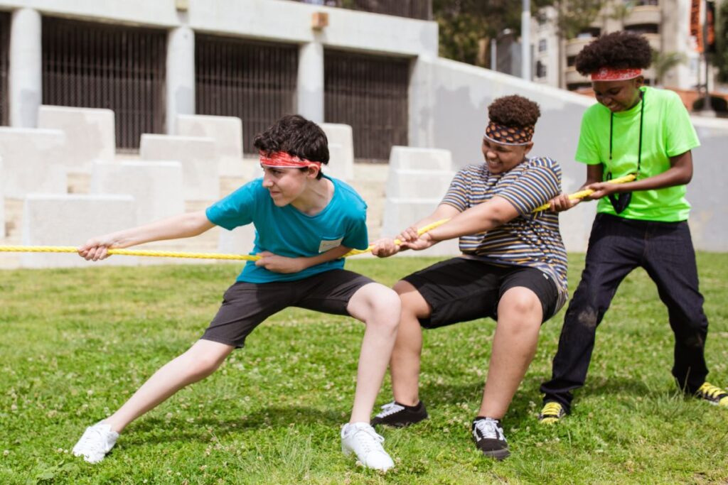 teens playing tug of war